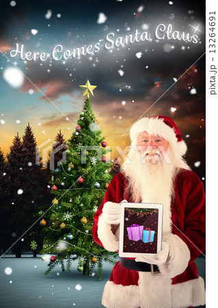 Composite image of santa presents a tablet pc Composite image of santa presents a tablet pc 13264691