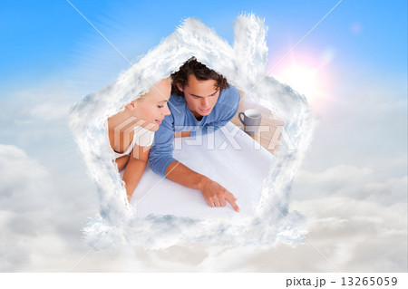 Composite image of cute man showing a point on a plan to his fia Composite image of cute man showing a point on a plan to his fia 13265059