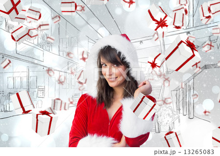 Composite image of pretty santa girl smiling at camera Composite image of pretty santa girl smiling at camera 13265083