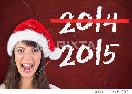 Composite image of young woman in santa hat yelling Composite image of young woman in santa hat yelling 13265154