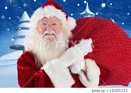 Composite image of jolly santa carries his sack 13265255