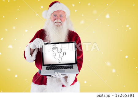 Santa claus presents a laptop 13265391