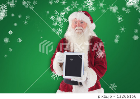 Composite image of santa presents a tablet pc Composite image of santa presents a tablet pc 13266156