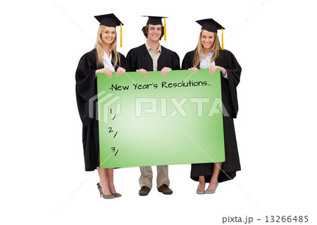Composite image of three students in graduate robe holding a bla 13266485