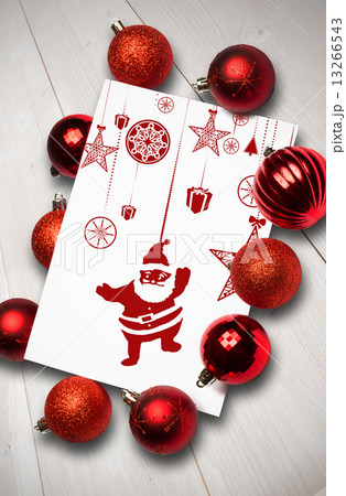Composite image of hanging red christmas decorations 13266543