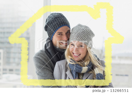 Composite image of cute couple in warm clothing smiling at camer Composite image of cute couple in warm clothing smiling at camer 13266551