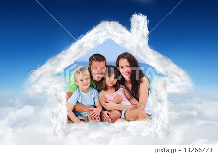 Composite image of portrait of a family at the beach 13266773