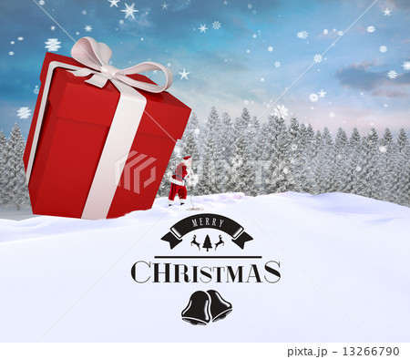 Composite image of santa delivering large gift Composite image of santa delivering large gift 13266790