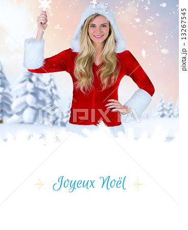 Composite image of pretty girl in santa outfit holding hand up 13267545