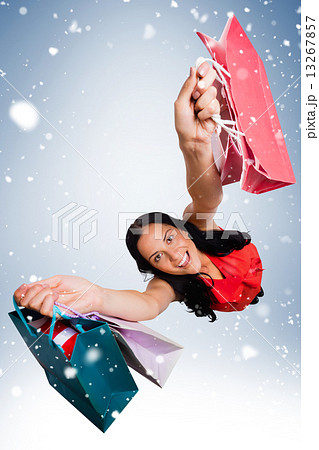 Woman standing with shopping bags Woman standing with shopping bags 13267857