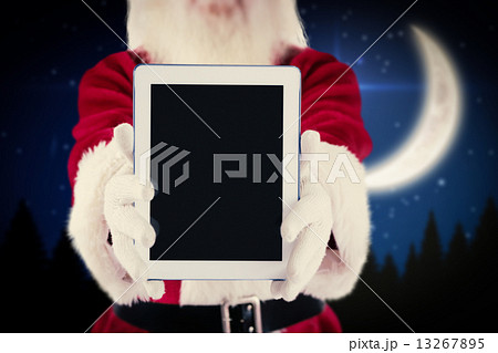 Composite image of santa presents a tablet pc Composite image of santa presents a tablet pc 13267895