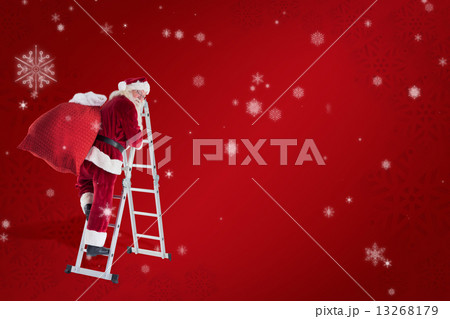 Composite image of santa steps up a ladder 13268179