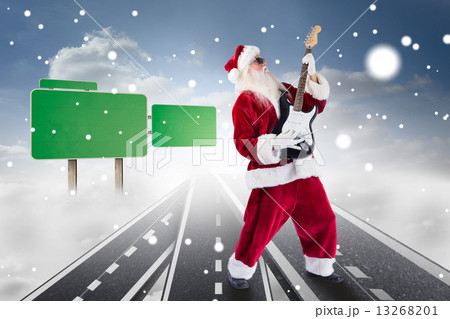 Composite image of santa playing electric guitar 13268201
