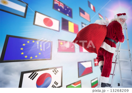 Composite image of santa steps up a ladder Composite image of santa steps up a ladder 13268209