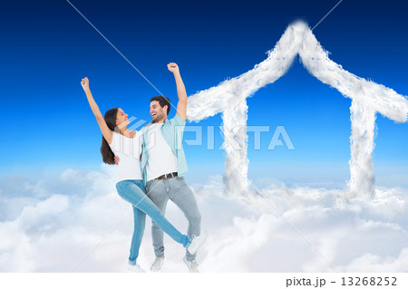 Composite image of happy casual couple cheering together Composite image of happy casual couple cheering together 13268252