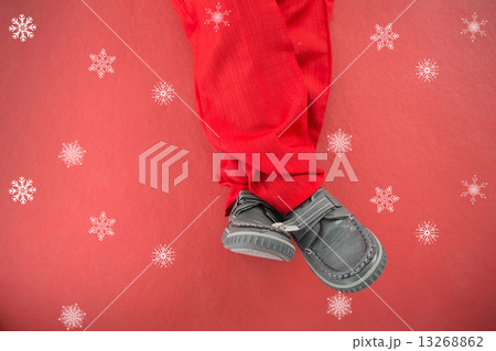 Composite image of little boys legs in santa costume Composite image of little boys legs in santa costume 13268862