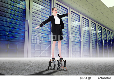 Composite image of business people supporting boss Composite image of business people supporting boss 13268868