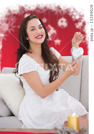 Composite image of pretty brunette with decoration Composite image of pretty brunette with decoration 13269026