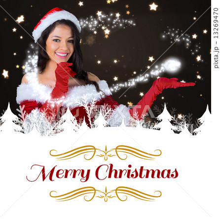 Composite image of pretty girl presenting in santa outfit Composite image of pretty girl presenting in santa outfit 13269470