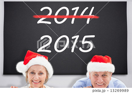 Composite image of festive couple showing poster 13269989
