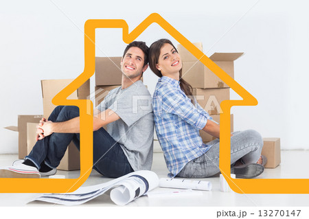 Composite image of beautiful couple sitting back-to-back 13270147