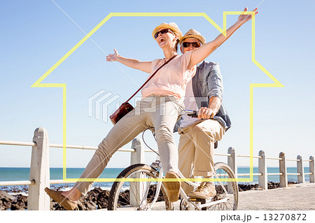 Composite image of happy casual couple going for a bike ride on Composite image of happy casual couple going for a bike ride on 13270872