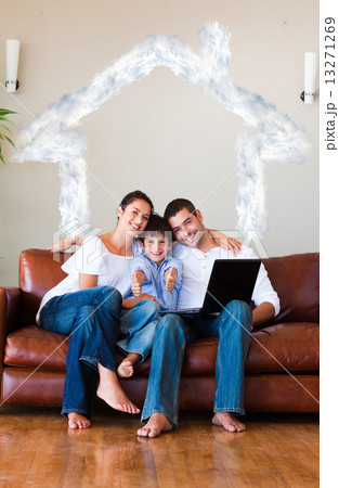 Composite image of family using a laptop with thumbs up and copy 13271269
