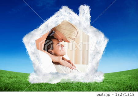 Composite image of woman kissing her fiance on the forehead Composite image of woman kissing her fiance on the forehead 13271318