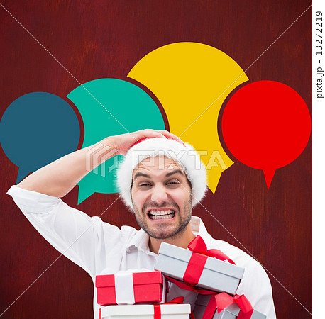 Festive man holding christmas gifts Festive man holding christmas gifts 13272219