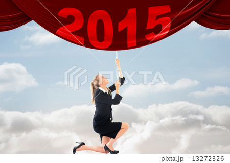 Composite image of businesswoman pulling a chain Composite image of businesswoman pulling a chain 13272326