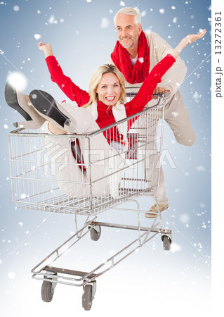 Happy festive couple messing in trolley 13272361