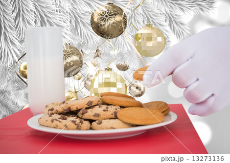Composite image of hand of santa taking cookie Composite image of hand of santa taking cookie 13273136