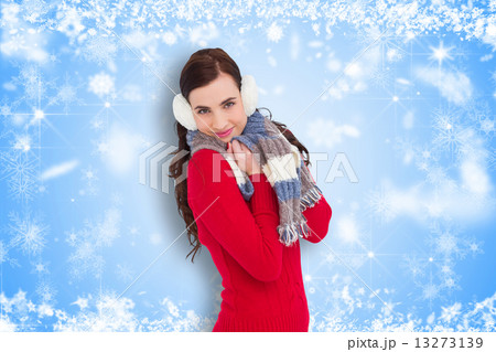 Composite image of pretty brunette in winter wear smiling at cam 13273139
