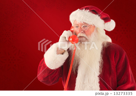 Composite image of santa on his red phone 13273335