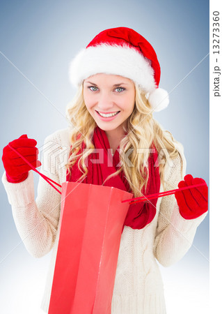 Happy festive blonde with shopping bag Happy festive blonde with shopping bag 13273360