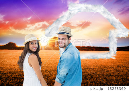 Composite image of happy hipster couple holding hands and smilin Composite image of happy hipster couple holding hands and smilin 13273369