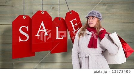 Composite image of happy blonde in winter clothes posing Composite image of happy blonde in winter clothes posing 13273409