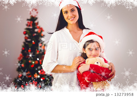 Composite image of festive mother and daughter smiling at camera Composite image of festive mother and daughter smiling at camera 13273958
