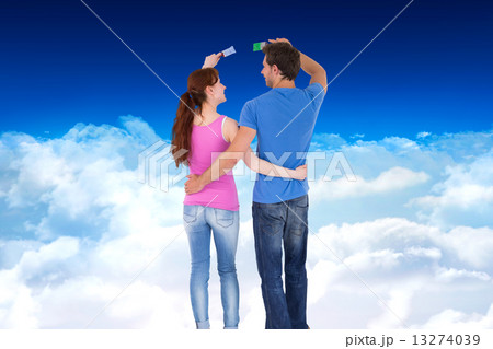 Composite image of couple both about to paint 13274039