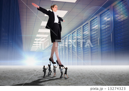 Composite image of business people supporting boss 13274323