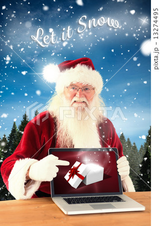 Composite image of happy santa showing laptop screen Composite image of happy santa showing laptop screen 13274495