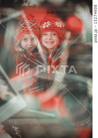 Composite image of festive little girls under a blanket Composite image of festive little girls under a blanket 13274608