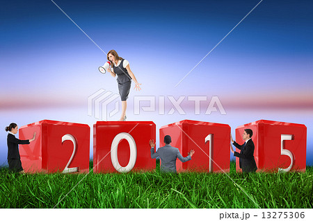 Composite image of businesswoman shouting through megaphone 13275306