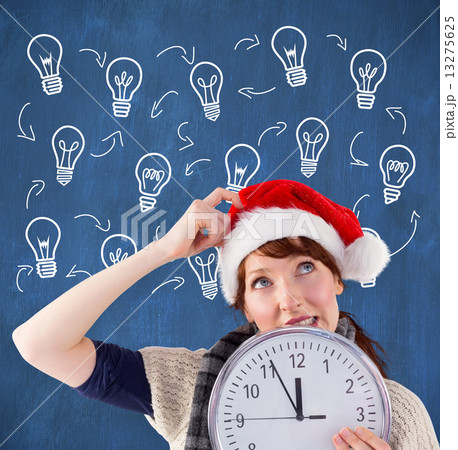 Composite image of woman holding a large clock Composite image of woman holding a large clock 13275625