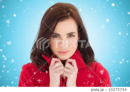 Composite image of portrait of a pretty brunette in red coat Composite image of portrait of a pretty brunette in red coat 13275734