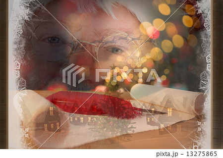 Composite image of santa claus is watching happy 13275865
