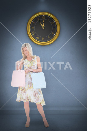 Composite image of elegant blonde with shopping bags 13275928