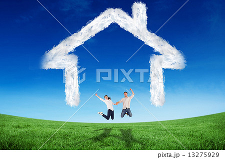 Composite image of couple jumping and holding hands 13275929