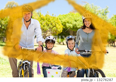 Composite image of family with their bikes 13276287