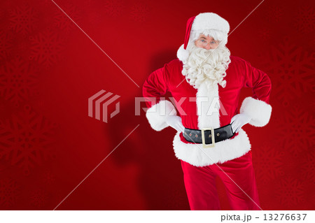 Composite image of cheerful santa claus with his hands on hips 13276637